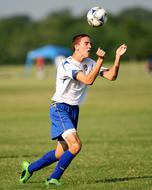 ball over running Soccer player