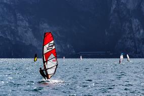 windsurfing on the sea against the backdrop of the mountain