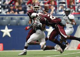 Colorful American football players, doing pass play, on the field, on the competition