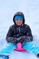 boy with Toboggan in the snow