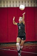 girl hitting the ball in volleyball