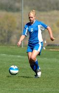 Soccer Game, girl runs to ball