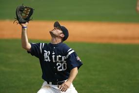 Baseball player in uniform on the green field