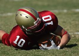 Football American Player lying on field