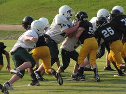 teamwork of american football players on the field