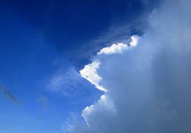 Blue Sky with fluffy white Clouds