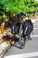 travel bags are hanging on the motorcycle