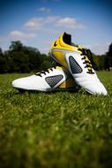 soccer shoes on green grass on the field