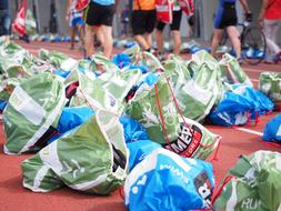 Colorful plastic bags on the court, on the sport event, near the people