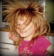 photo of a jumping girl with frayed hair