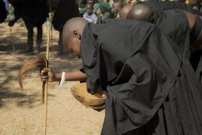 boy in black traditional African dress