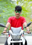 guy in a red t-shirt on a motorcycle