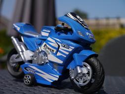 blue motorcycle as a miniature model on a blurred background