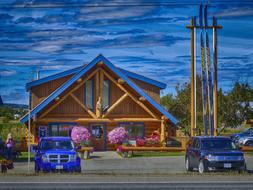 Wood Log House and automobiles