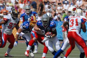 playing american football on a sunny day close up