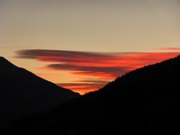 Beautiful landscape of the mountains, at beautiful and colorful sunrise in the sky, with the clouds