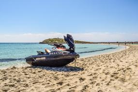 jet ski on a sandy coast on a sunny day