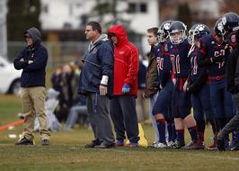 Football Team Coach on field