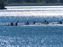 distant view of travelers on a canoe on the lake