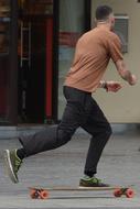 guy on a skateboard on a city street