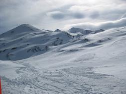 ski tracks in the snowy alps on a sunny day