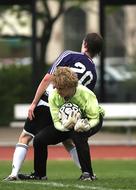 goalkeeper with the ball at the match