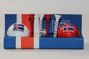 White, red and blue golf balls with flag of Iceland