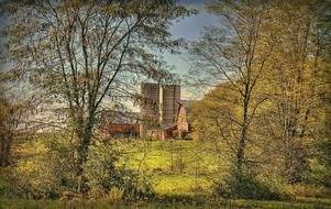 Beautiful landscape of the barn with towers, on the colorful field with trees, in Ohio, USA