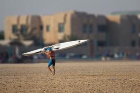 surfer on the beach in blurred background