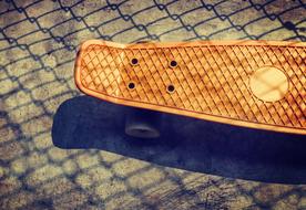 skateboard with shadow on the track