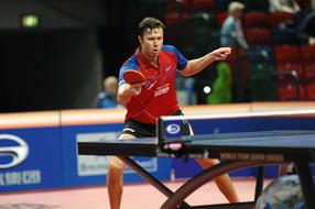 Man playing table tennis on the competition