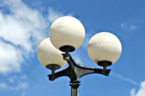 street lamp with three white round shades
