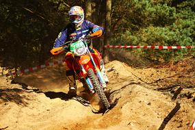 motorcyclist on a sandy road during racing