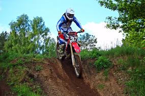 motorcyclist on a racing bike descends the hill