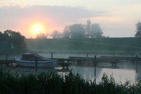 boat on the river on a foggy morning