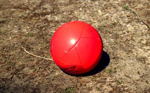 Ball Football Red on the ground close-up