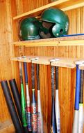 Baseball Bats Helmet on shelf