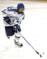 hockey player in uniform on ice close up