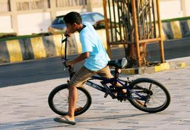 boy on bmx bike, india