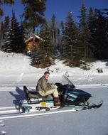 Boy on Snow Mobile at Winter