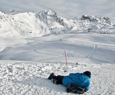 climber resting on a snowy mountainside