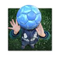 child with raised arms, blue soccer ball