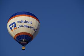 blue white hot air balloon in clear sky