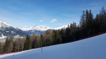 ski trace on Mountain slope near fir forest