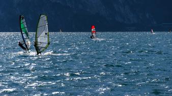 windsurfing, water reflections