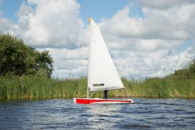 Sail Boat on Lake near shore