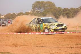 Car Rally Race in brown dust