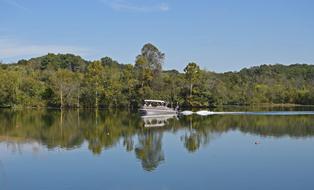 Motor-Boating Fisherman Lake