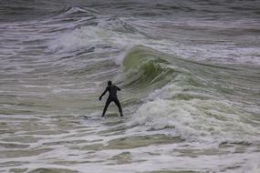 Surfer on Wave Ocean Water