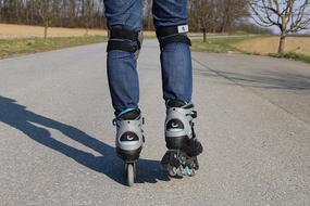 man rollerblading in the park